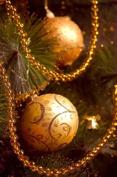 Beautiful color christmas decorations hanging on christmas tree with shiny glare — Stock Photo, Image