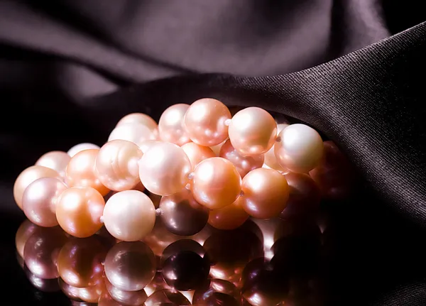 Beautiful pearls on black background — Stock Photo, Image