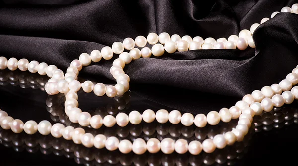 Pearls on black background — Stock Photo, Image