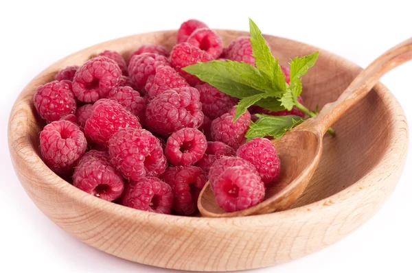 Raspberry in wooden plate — Stock Photo, Image