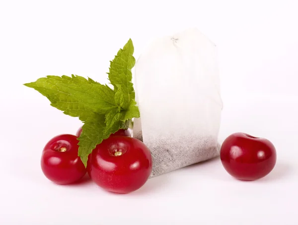 Tea package with cherry — Stock Photo, Image