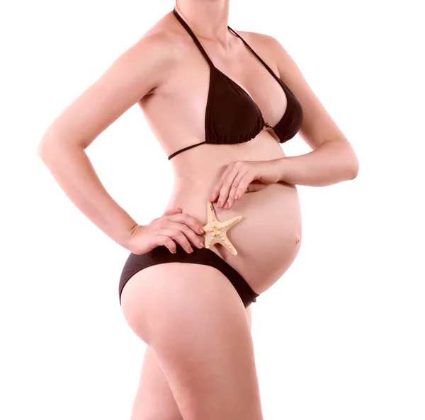 Bikini femme enceinte avec étoile de mer — Photo