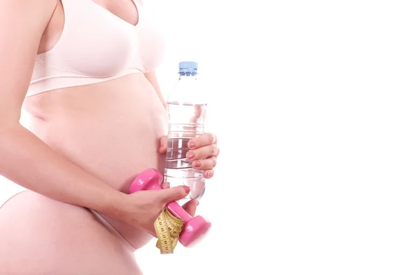Terhes nő vízzel és néma-csengő — Stock Fotó