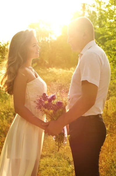 Beautiful wedding couple in the garden — Stock Photo, Image