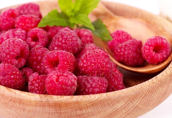 Raspberry in wooden plate — Stock Photo, Image