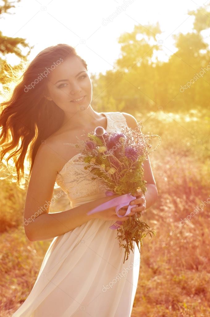 Bride with flowers in dress