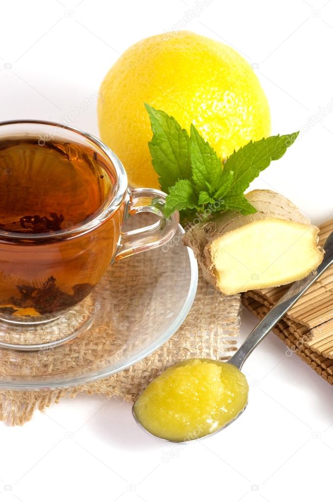 Cup of tea with ginger, lemon, honey and mint Stock Photo by