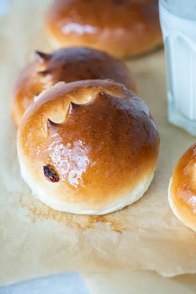 Sweet Milk Buns Raisins Baking Paper Overhead View — Zdjęcie stockowe