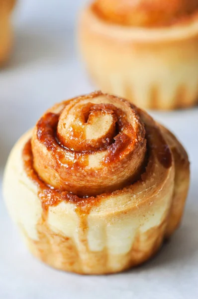 Freshly baked caramel cinnamon bun. Close up.