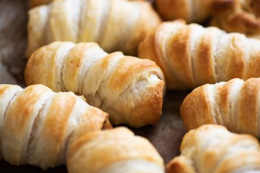 Pigs in a blanket - puff pastry baking with sausages.