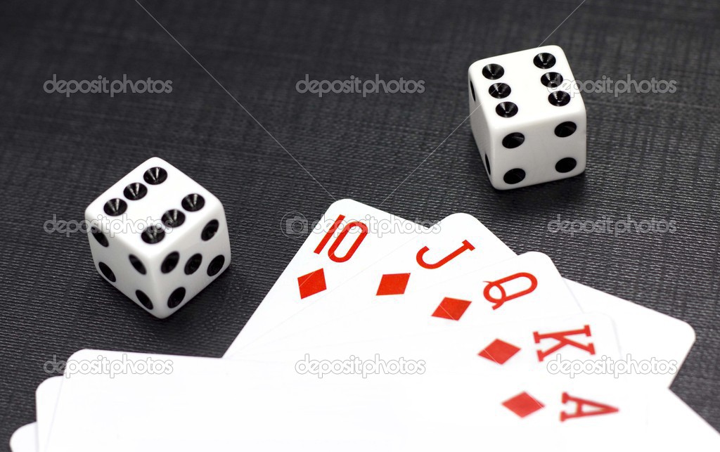 Dices and playing cards on a black background