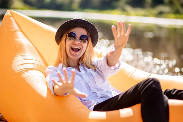 Happy Young Woman Arms Raised Celebrating Something While Relax Inflatable — Stok Foto