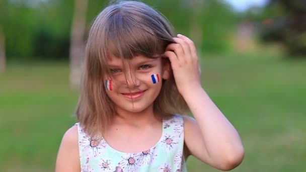 Slow Motion Adorable Little Girl Smile Camera Cheeks Painted Flag — 비디오