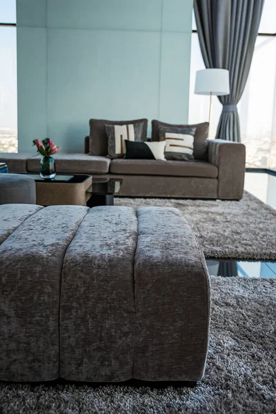 The interior design of the glass room on the condo Can see the view outside, with sofas and pillows for relaxing.