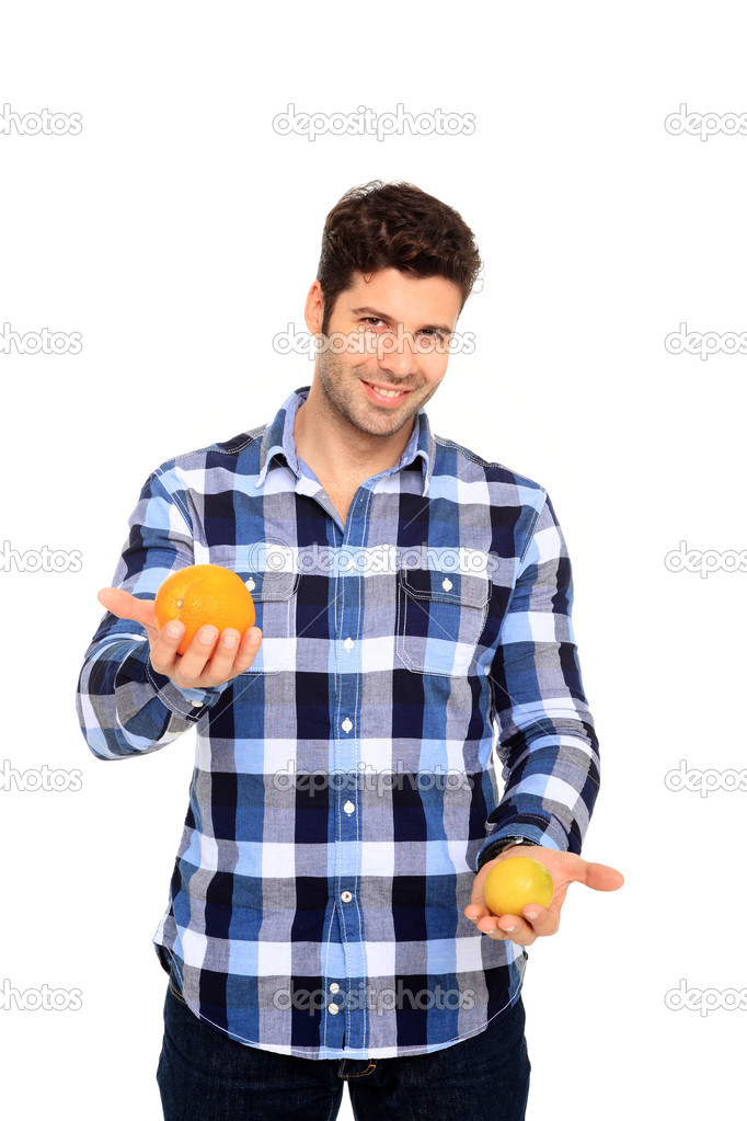man holding orange and lemon