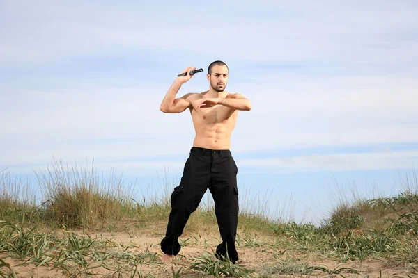 Martial arts instructor with knife — Stock Photo, Image