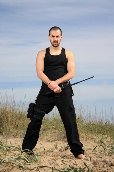 Bodyguard in the sand — Stock Photo, Image