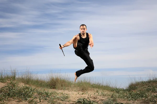 Bodyguard jumping in the air — Stock Photo, Image