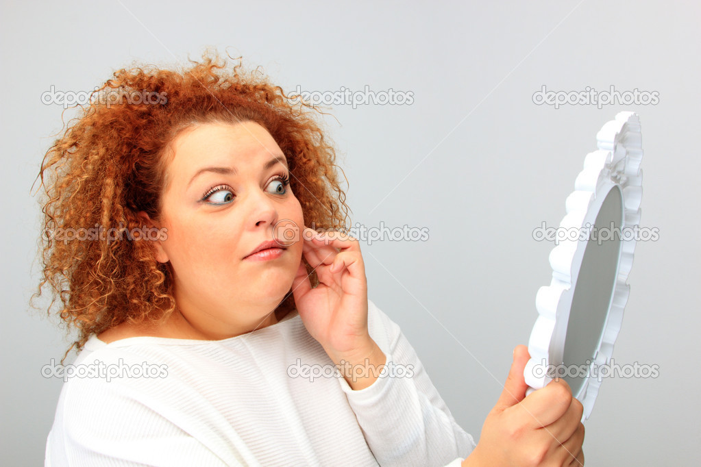 girl looking at the mirror