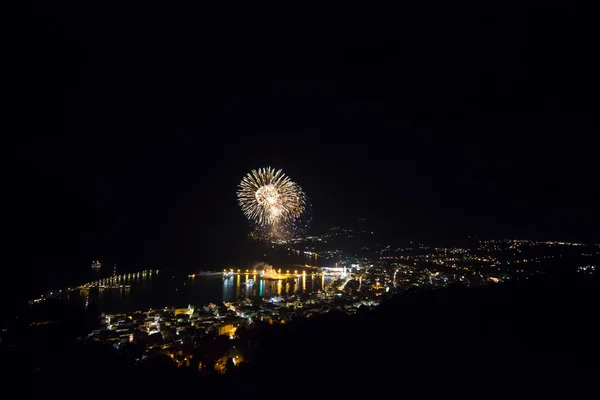 Fireworks in a small city at night — Stock Photo, Image