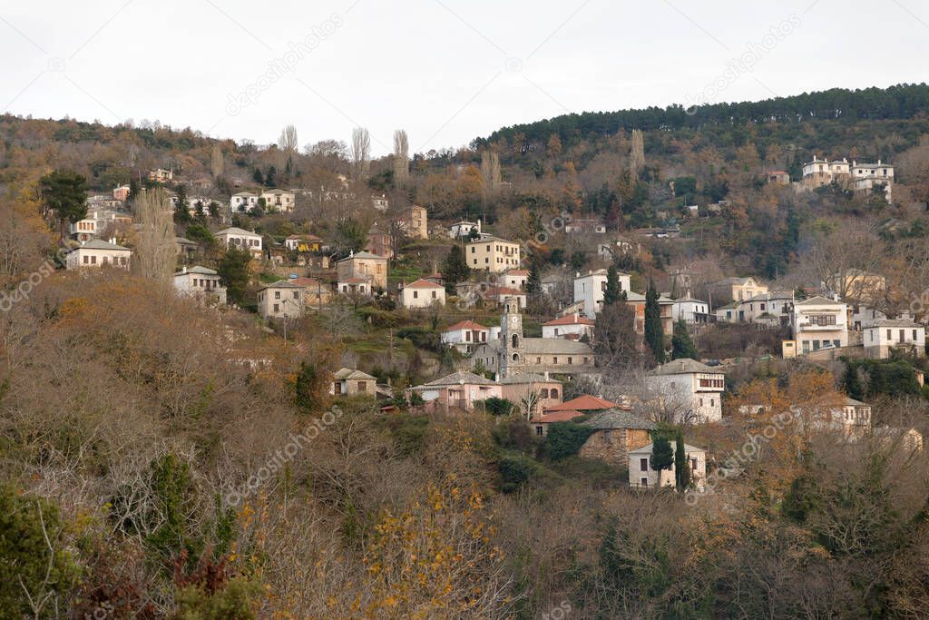 Panoramic view of a traditional village with stone houses on a cloudy day in Pelion, Greece