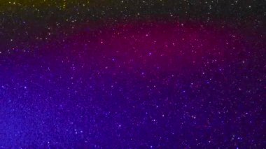 Işığın yanıp sönen renkli noktalarının hareket eden arkaplanı
