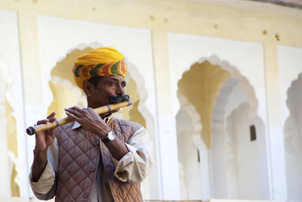 Musician plays flute — Stock Photo, Image