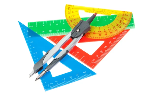 A set of rulers for the school and a compass on a white backgrou — kuvapankkivalokuva