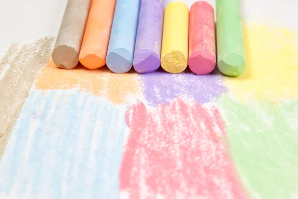 Pieces of chalk on paper. — Stock Photo, Image