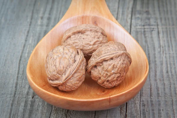 Walnuts for Christmas on a wooden spoon. — Stock Photo, Image