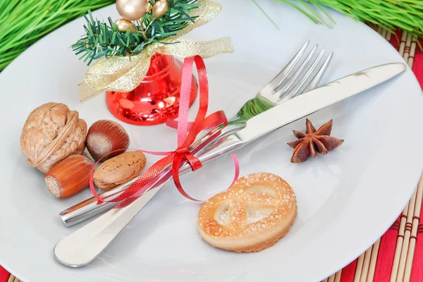 Arrangement of Christmas objects, bells, and nuts. — Stock Photo, Image