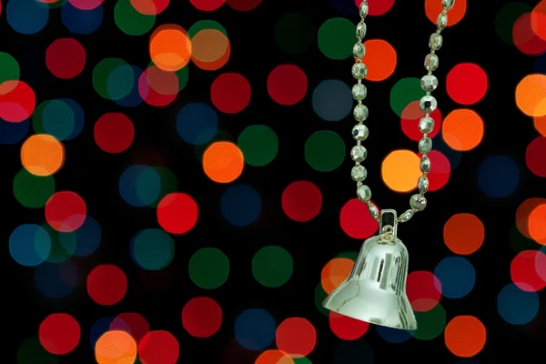 Golden Christmas bell on a background bokeh lights. — Stok Foto