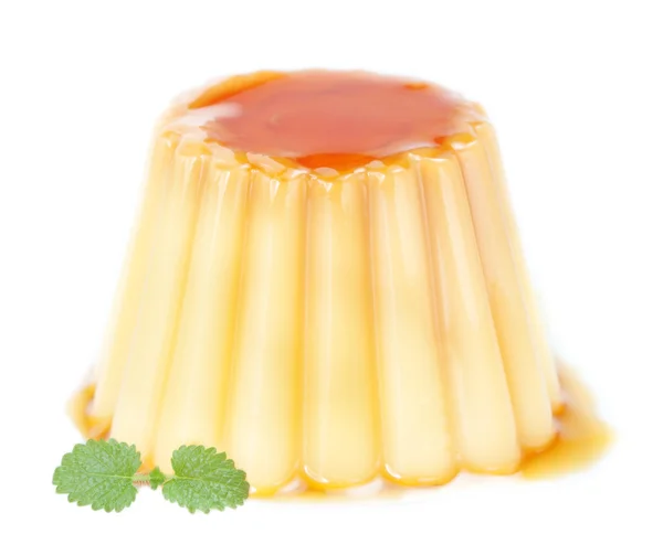 Delicious pudding with caramel and mint leaves. On a white backg — Stock Photo, Image