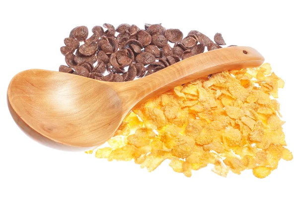 Chocolate and corn flakes with a wooden spoon. On a white backgr — Stock Photo, Image