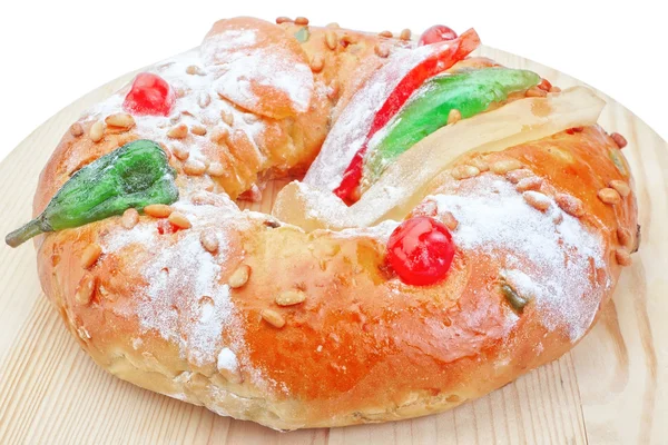 Portuguese king cake on a wooden stand. On a white background. C — Stock Photo, Image