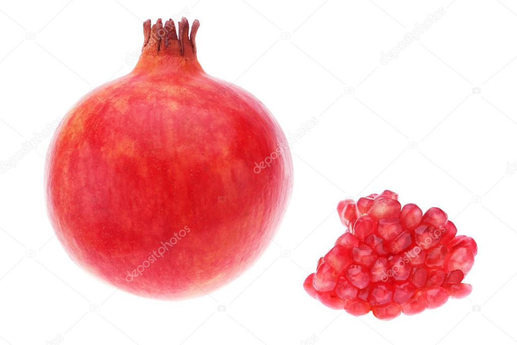 Red pomegranate fruit grains on a white background. Close-up.