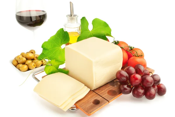 Breakfast of cheese fruit and vegetables and wine. — Stock Photo, Image