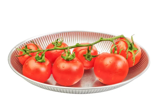 Bunch of red tomatoes in an iron plate rack. On a white backgrou — Stock Photo, Image