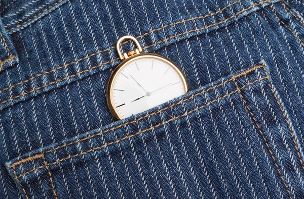 Pocket watch in a jeans pants. Closeup. — Stock Photo, Image