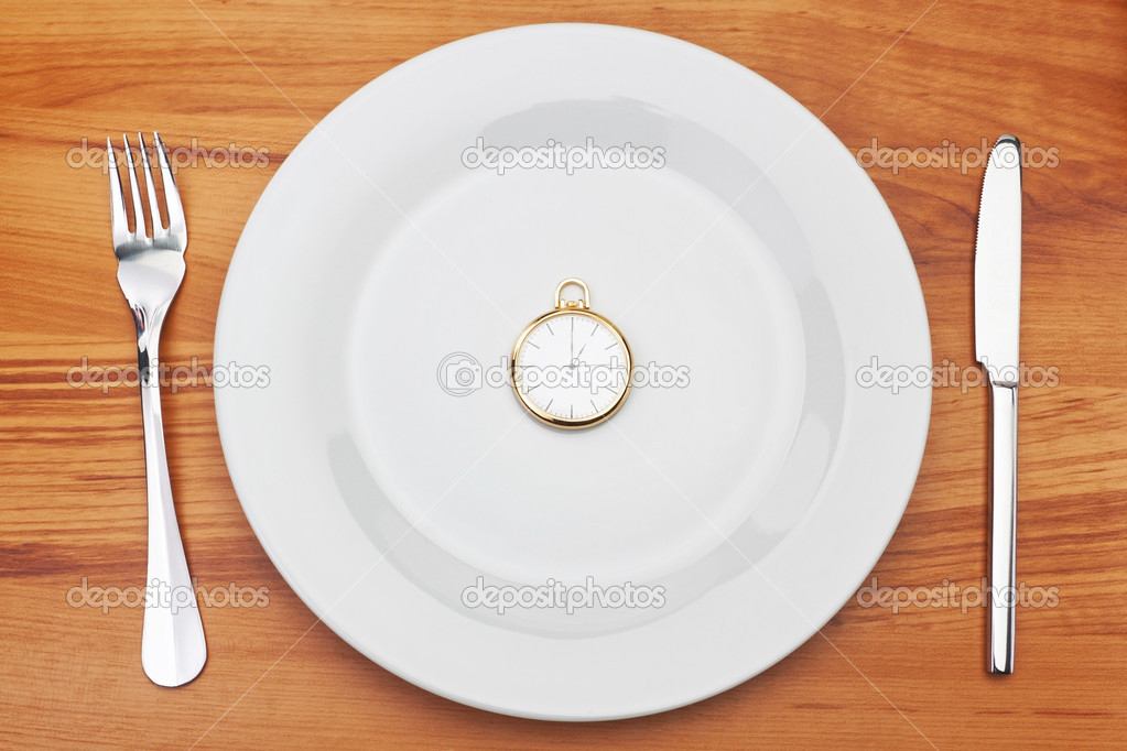 Concept image plate fork and pocket watches. Time for dinner.