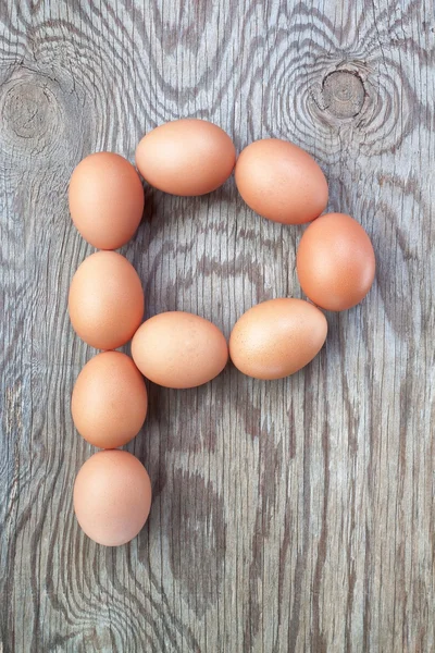 A letter p from the eggs for Easter. On a wooden texture. — Stock Photo, Image