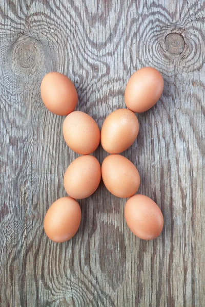 A letter x from the eggs for Easter. On a wooden texture. – stockfoto