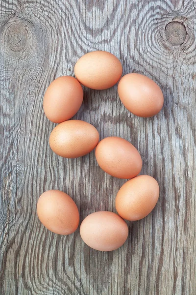 A letter s from the eggs for Easter. On a wooden texture. – stockfoto