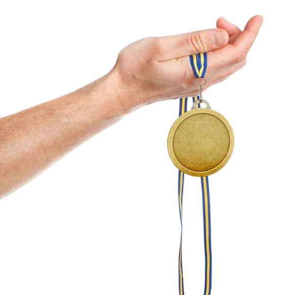 Gold medal winner in the hand. On a white background. — Stock Photo, Image