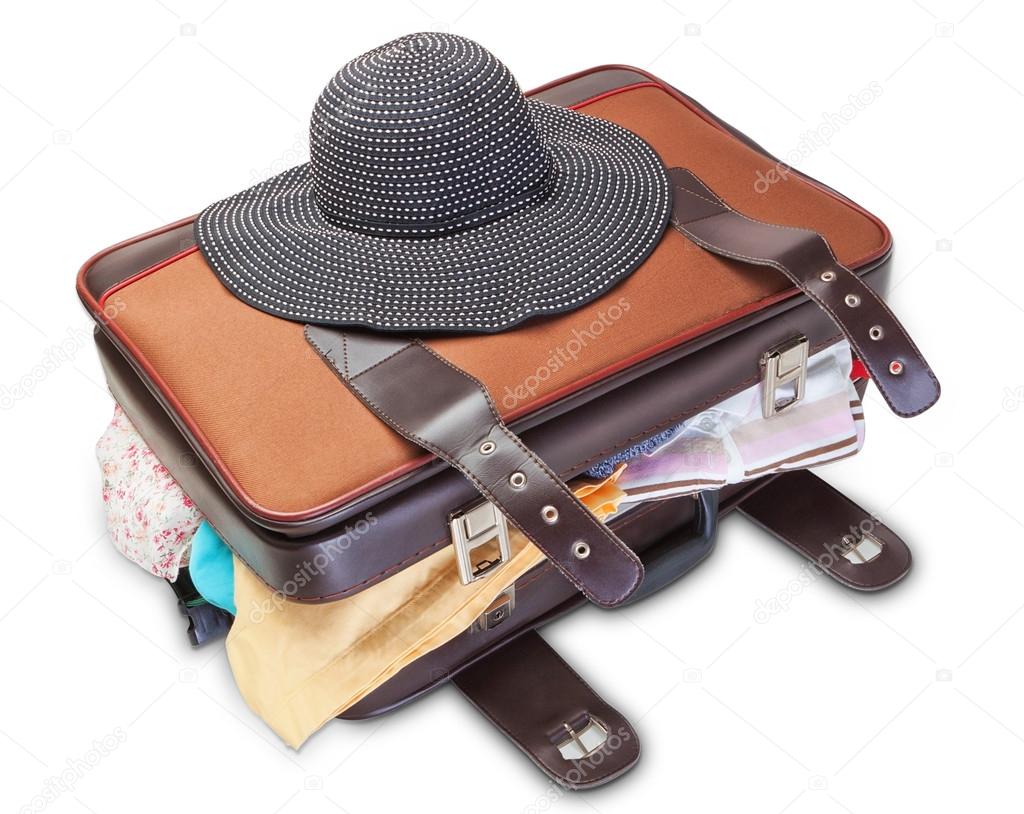 Panama women on a suitcase for a holiday. On a white background.