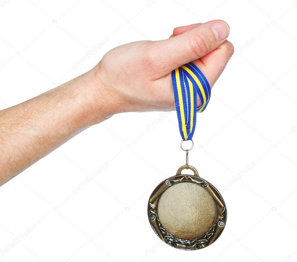Gold Medal winner in the hand. On a white background.