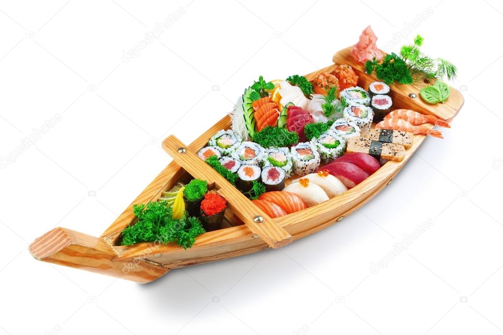 Collection of species sushi on the decorative plate ship. On a w