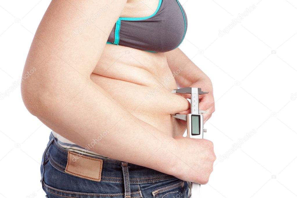 Fat woman measuring calipers layer of fat belly. On a white back