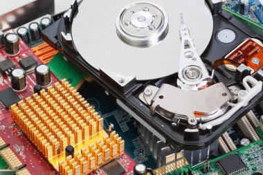 A pile of computer parts motherboard hard drive. Close-up.