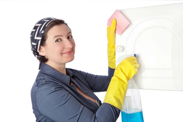 A middle-aged housekeeper cleans the interior. Close-up. — Stockfoto